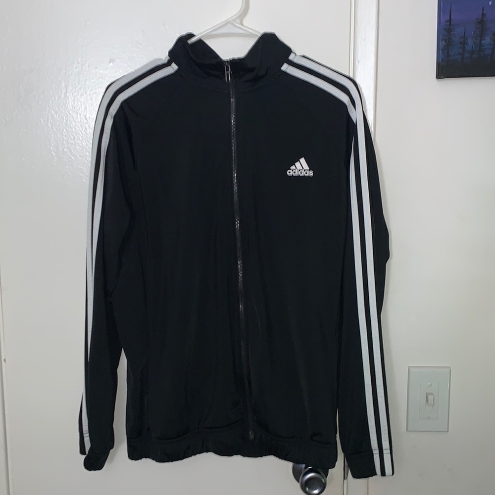 Woman’s black Adidas jacket